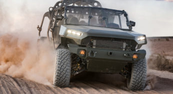 CHEVROLET COLORADO BEHIND US ARMY INFANTRY VEHICLE